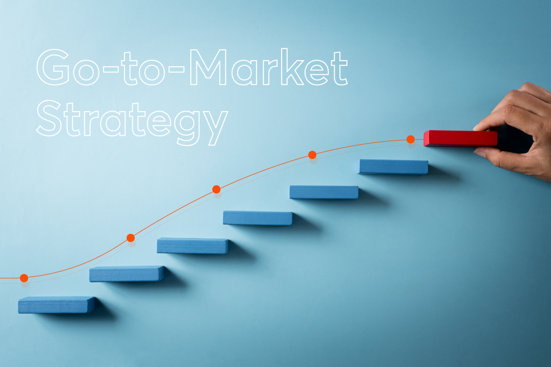 Go-to-Market Strategy concept with blue steps, upward growth line, and hand placing red block